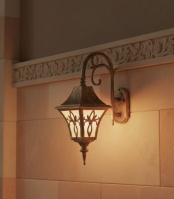 antique gold regal arm wall light night view