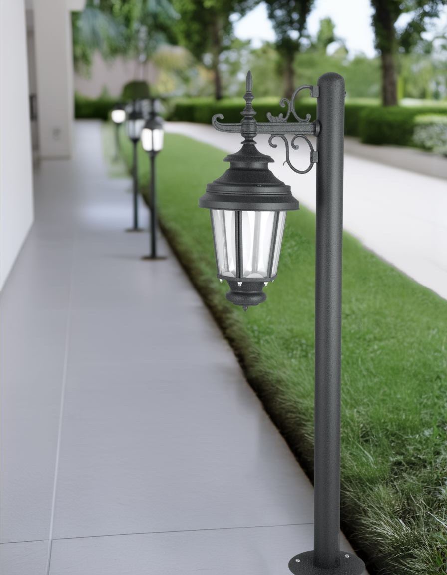 Pinnacle Bollard by Kyess Lighting, elegantly lining a modern pathway, offering both style and safety with its sturdy design and effective lighting